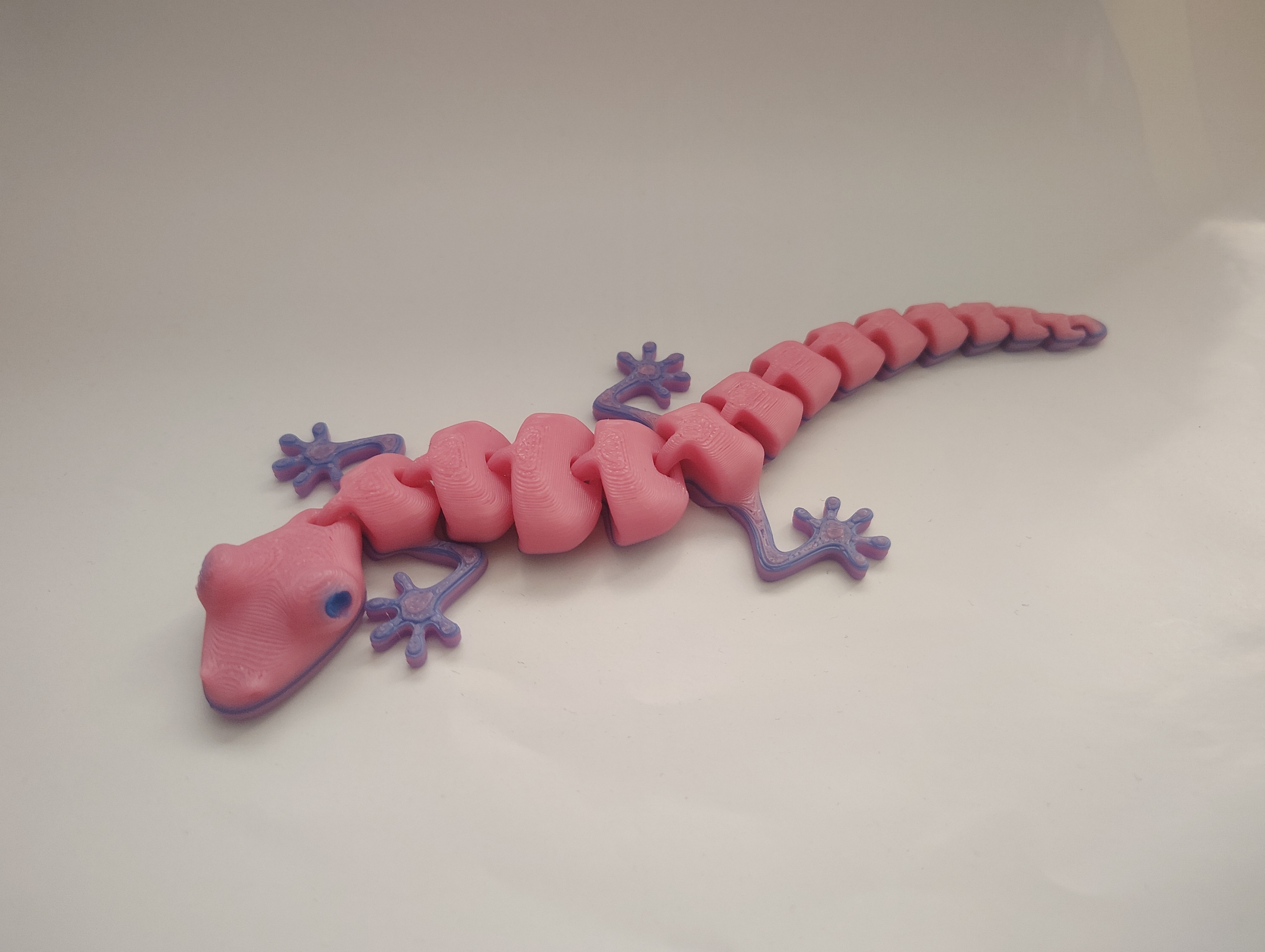 Pink and lavender articulated 3D-printed gecko